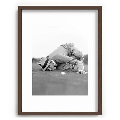 Eye to the ground on the 18th hole; golfing man eyes ball to measure distance to hole vintage black and white portrait photograph - photography - photographs poster Framed Art Print Gallery Image 91