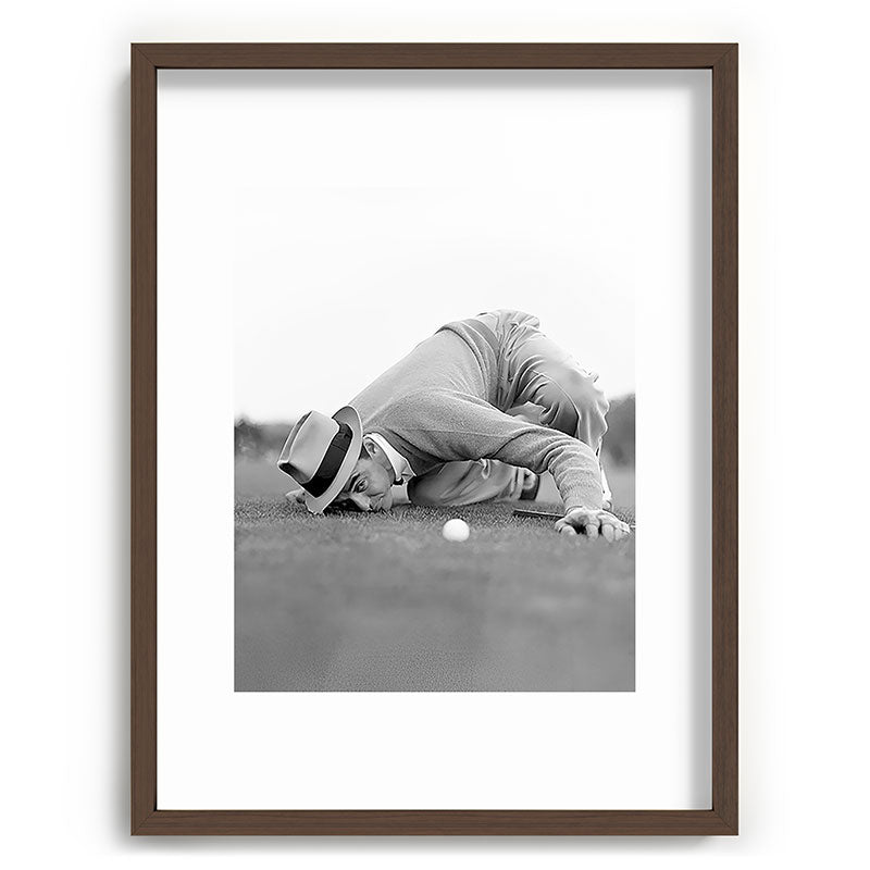 Eye to the ground on the 18th hole; golfing man eyes ball to measure distance to hole vintage black and white portrait photograph - photography - photographs poster Framed Art Print Gallery Image 92