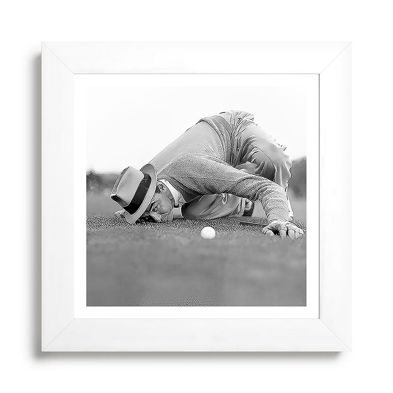Eye to the ground on the 18th hole; golfing man eyes ball to measure distance to hole vintage black and white portrait photograph - photography - photographs poster Framed Art Print Gallery Image 79
