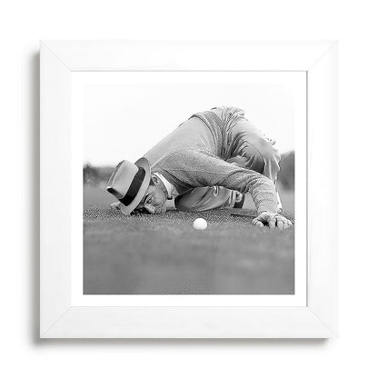 Eye to the ground on the 18th hole; golfing man eyes ball to measure distance to hole vintage black and white portrait photograph - photography - photographs poster Framed Art Print Gallery Image 79