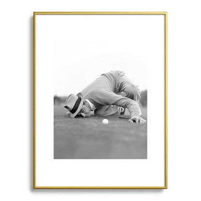 Eye to the ground on the 18th hole; golfing man eyes ball to measure distance to hole vintage black and white portrait photograph - photography - photographs poster Framed Art Print Gallery Image 124