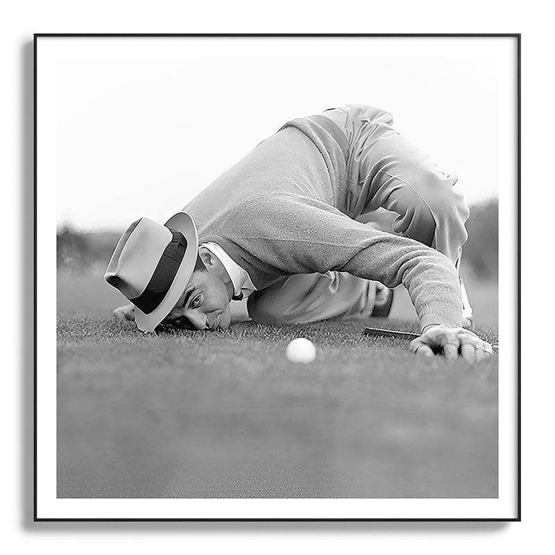 Eye to the ground on the 18th hole; golfing man eyes ball to measure distance to hole vintage black and white portrait photograph - photography - photographs poster Framed Art Print Gallery Image 130