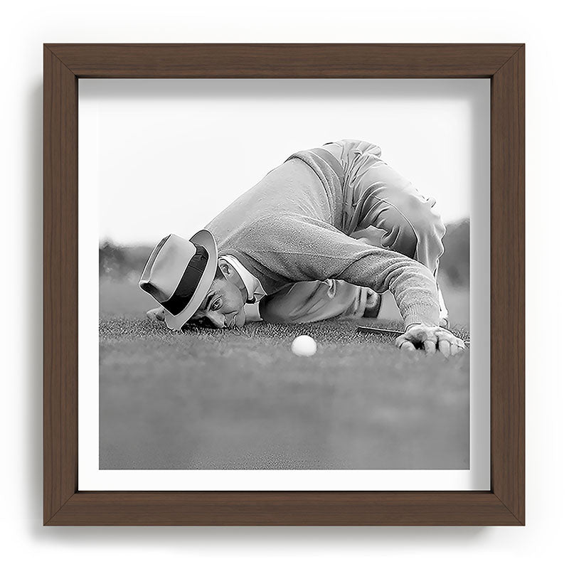 Eye to the ground on the 18th hole; golfing man eyes ball to measure distance to hole vintage black and white portrait photograph - photography - photographs poster Framed Art Print Gallery Image 98