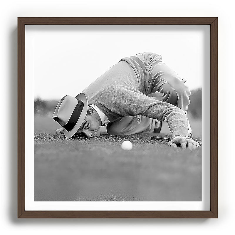 Eye to the ground on the 18th hole; golfing man eyes ball to measure distance to hole vintage black and white portrait photograph - photography - photographs poster Framed Art Print Gallery Image 101