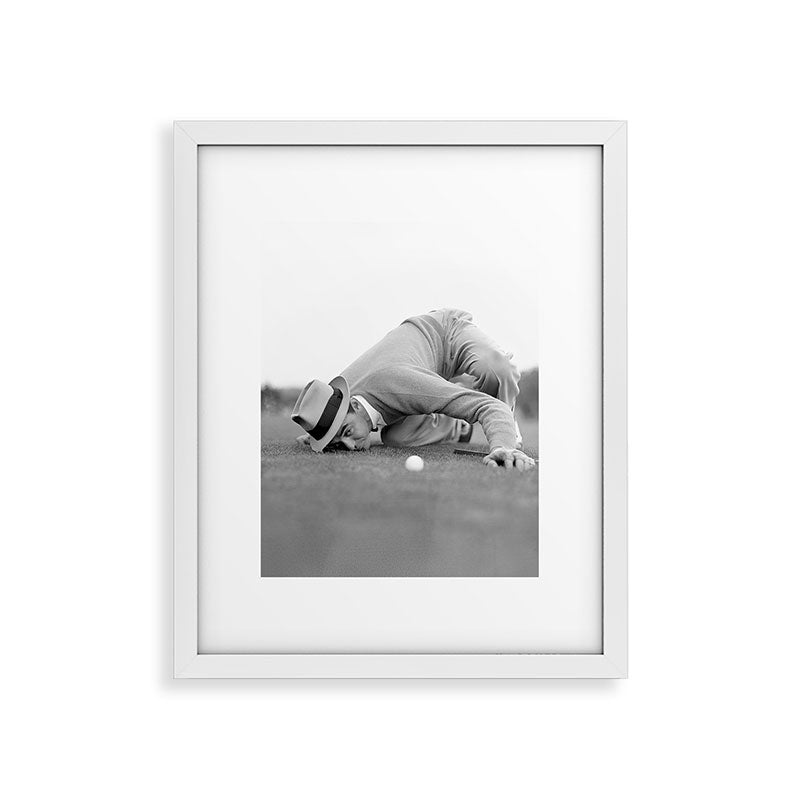 Eye to the ground on the 18th hole; golfing man eyes ball to measure distance to hole vintage black and white portrait photograph - photography - photographs poster Framed Art Print Gallery Image 31