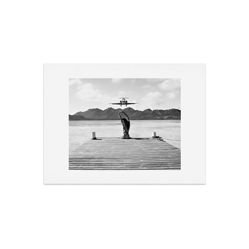 Steady as she goes girl in bikini on a dock with plane landing black and white photograph Art Print Gallery Image 8